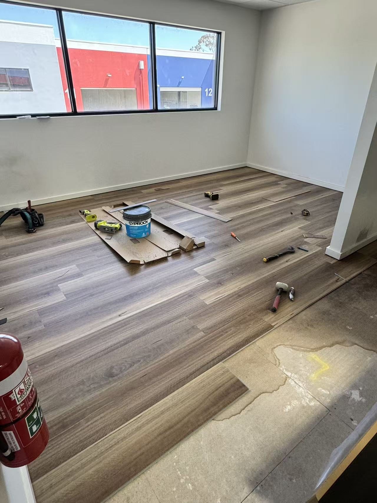 Close-up detail of newly installed timber-look flooring boards.