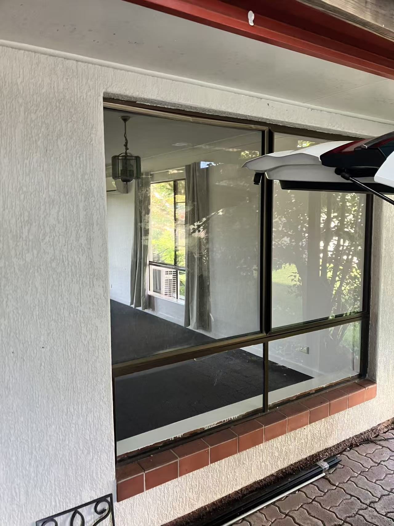 Close-up of a completed flyscreen installed at a window.